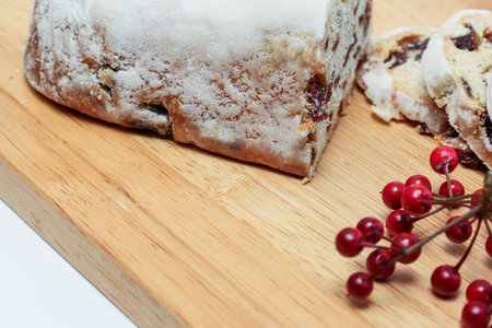 Stollen on the cutting board isolated on a white background.の写真素材