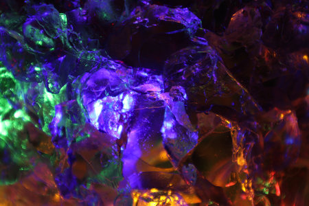 Colorful illumination in a glass isolated in a black background.