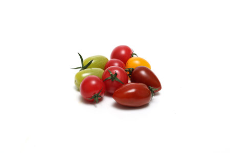 Various color Cherry tomatoes isolated on a white background.の写真素材