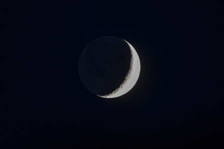 Crescent Moon in the night sky.の写真素材