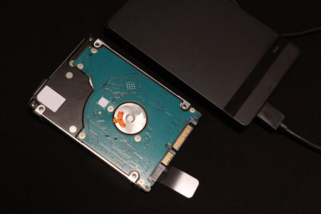 Internal 2.5-inch hard disk isolated on a black background.