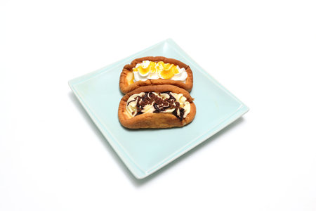 Pancakes with whipped cream on a crockery isolated on a white background.