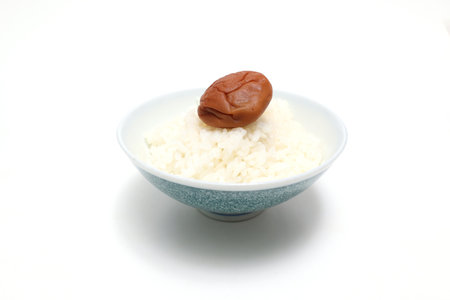 Pickled plum on a rice isolated on a white background.の写真素材