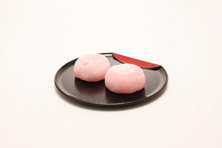 Soft round rice cake stuffed with sweet bean jam in a glass bowl isolated on a white background.の写真素材