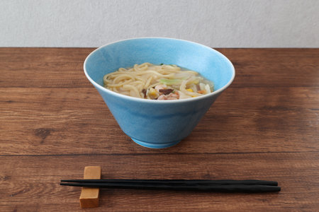 Japanese noodle soup on a wooden table.の写真素材