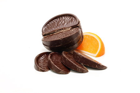 Orange flavor chocolates isolated on a white background.の写真素材