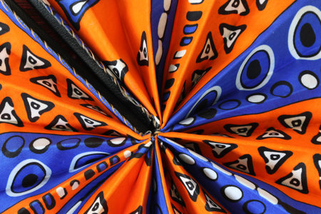 African Round fan with geometric pattern for backgrounds.の写真素材