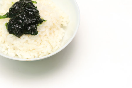 Simmered Seaweed Paste on a rice isolated on a white background.の写真素材