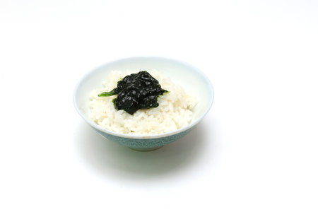 Simmered Seaweed Paste on a rice isolated on a white background.の写真素材