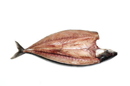 Mackerel cut open and dried isolated on a white background.