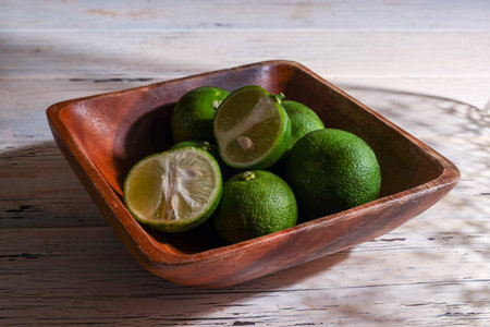 Kabosu that is a type of citrus fruit on the wooden table.の写真素材