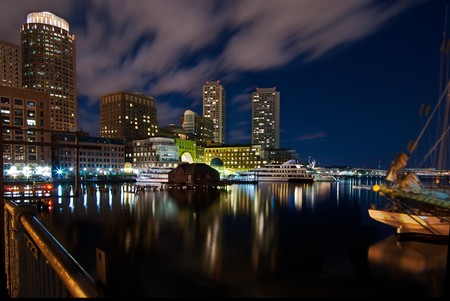 A night shot of the Boston inner harbor looking back towards downtown.の写真素材