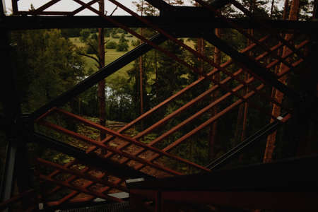 Close up view on observation tower construction elements, wooden tower in forest, wooden stairs
