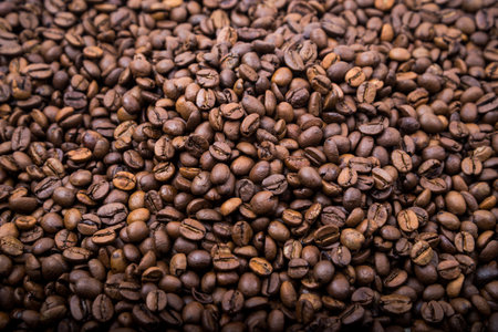 top view of fresh roasted coffee beans background. Background of roasted coffee beansの写真素材