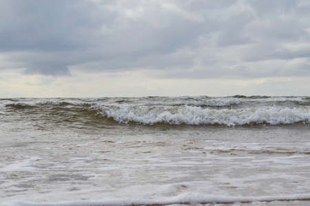 double seawater wave on a summer day with a cloudy sky.Summer landscapeの写真素材