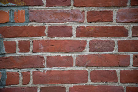 Red grunge brick wall, abstract background texture with old dirty and vintage style pattern. closeup macro photographyの写真素材