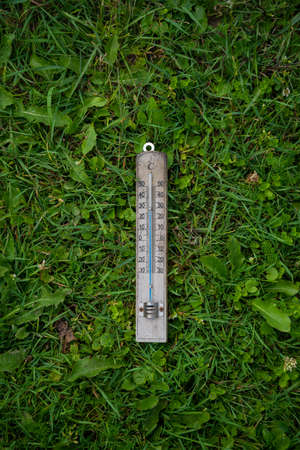 thermometer on grass top view copy spaceの写真素材