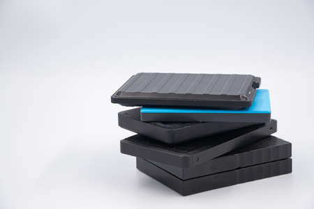 Small portable hard drives in stack.の写真素材