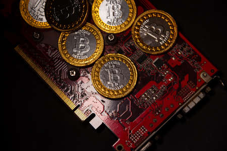 Bitcoin coin on a red video card background. Cryptocurrency, virtual money. Blockchain technology,...