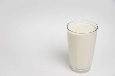 Milk glass closeup on white background