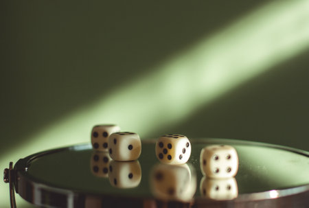 Playing dice on glass with reflections in it.の写真素材