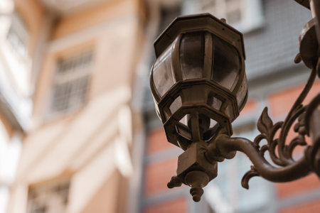 Close up of retro vintage old time street light metal lamp with blurred background