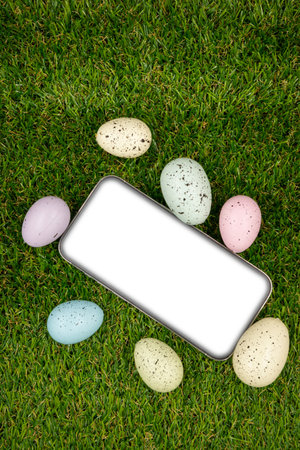Phone with blank empty white screen on background of easter eggsの写真素材