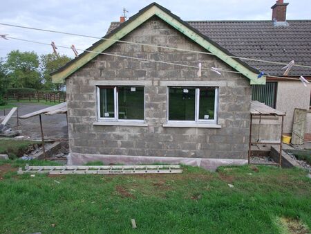 Building new homes at a construction site in Ireland including roofers joiners builders painters labourers,の写真素材