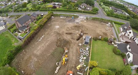 Building new homes at a construction site in Ireland including roofers joiners builders painters labourers, aerial photo by aの写真素材