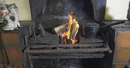 Sticks Blocks firewood and Peat Turf burning in an open fire from a Bog in Ireland 4の写真素材