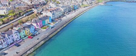 Colourful painted houses by the sea at Whitehead Bay Co. Antrim Northern Irelandの写真素材