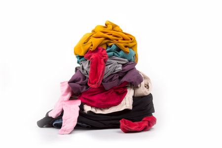 dirty laundry waiting to be washed, on a white backgroundの写真素材