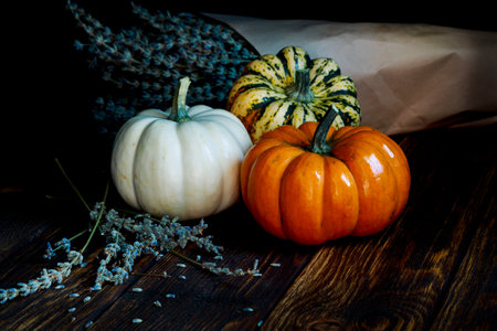 colorful sweet pumpkins on wooden backgroundの写真素材