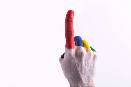 Painted hand with the colors of the LGBT flag on a white backgroundの写真素材