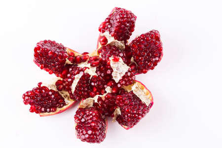 fresh pomegranate isolated onblack background close-upの写真素材