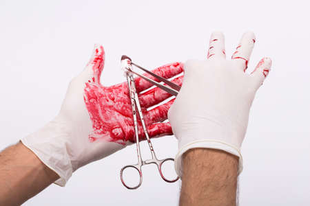 sterile and bloody operating room supplies performing surgery,isolated backgroundの写真素材