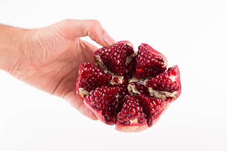 fresh pomegranate isolated onblack background close-upの写真素材