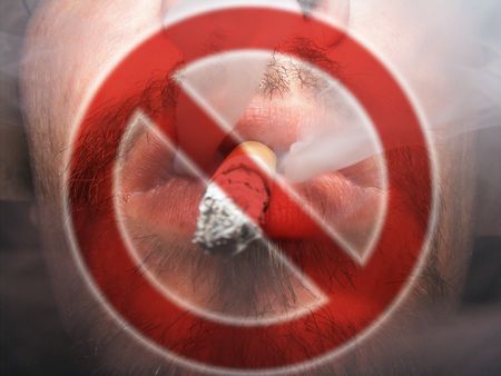 image of man smoking a cigaretteの写真素材