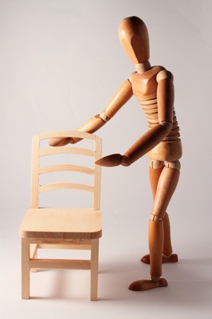 wooden dummy offering empty chairの写真素材