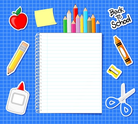 school supplies stickers and blank notebook on blue grid backgroundの写真素材