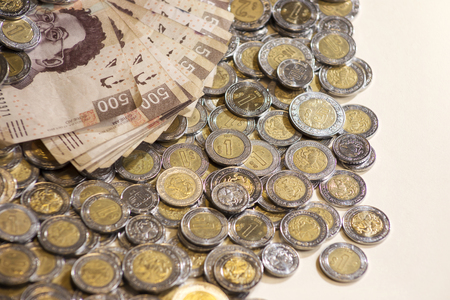 mexican pesos banknotes and coins backgroundの写真素材