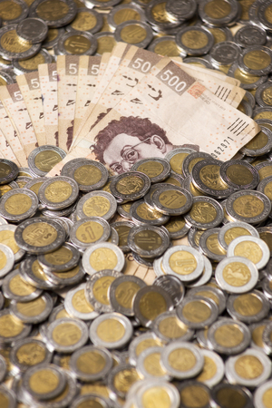 mexican pesos banknotes and coins backgroundの写真素材