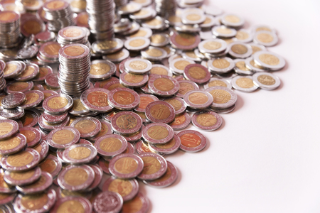 a lot of mexican pesos coins backgroundの写真素材
