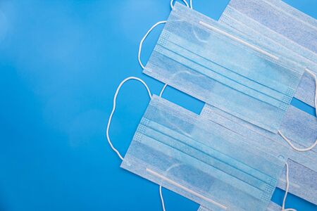 Disposable medical face masks to prevent infection on classic blue