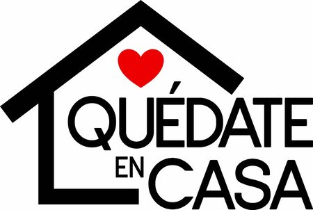 Quote in spanish "quedate en casa" (Stay at Home) black with red heart. isolated on white background. Social distancing campaign during quarentine COVID-19 pandemicのイラスト素材