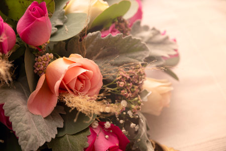 close up of centerpiece roses and foliageの写真素材