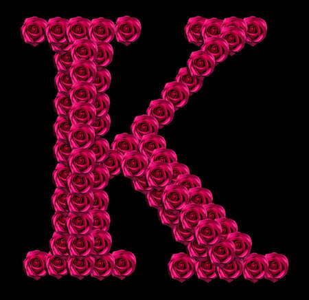 romantic concept image of a capital letter K made of red roses. Isolated on black background. Design element for love or valentines themesの写真素材