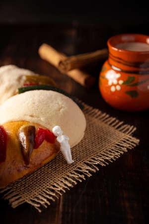 Traditional Kings day cake also called Rosca de Reyes, roscon, Epiphany Cake and with a clay Jarrito. Mexican tradition on January 5thの写真素材