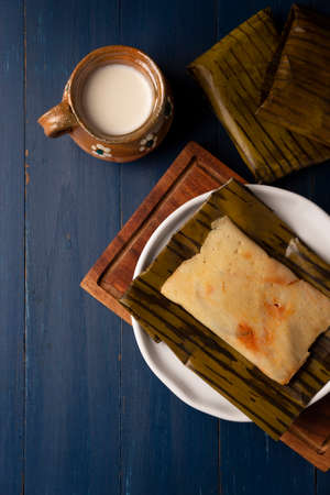 Prehispanic dish typical of Mexico and some Latin American countries. Corn dough wrapped in banana leaves. The tamales are steamed.の写真素材