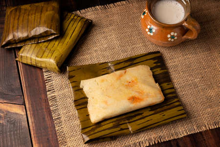 Prehispanic dish typical of Mexico and some Latin American countries. Corn dough wrapped in banana leaves. The tamales are steamed.の写真素材